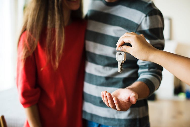 People being handed the keys to a home.